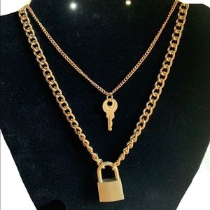 Gold chain necklace set with lock and key